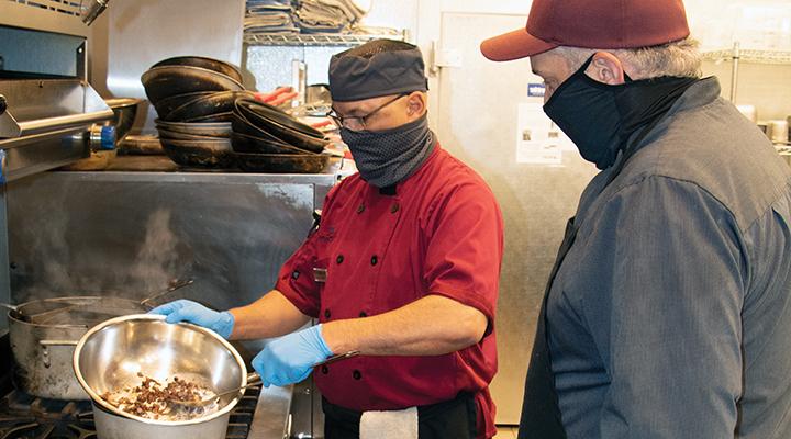 Jose Velez learns the finer points of melting chocolate from executive chef Kenneth Kinser